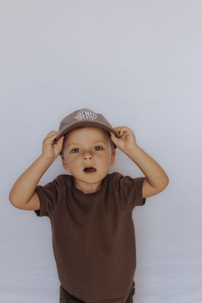 cute kid wearing custom logo hat